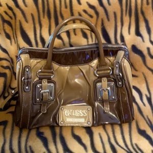 Very cute vintage Guess bag, large enough to hold tablet makeup phone books.